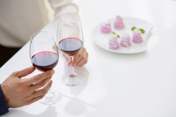 Young loving couple drinking red wine - Photo, image