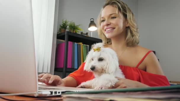2-Business Woman Holding Dog During Skype Conference Call - Кадри, відео