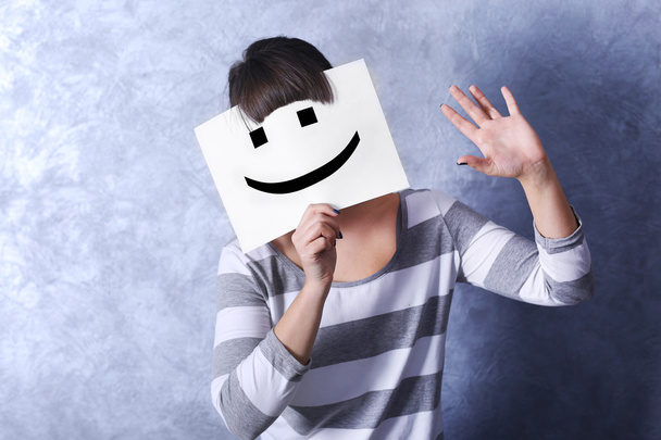 Woman showing a happy emoticon  - Fotografie, Obrázek