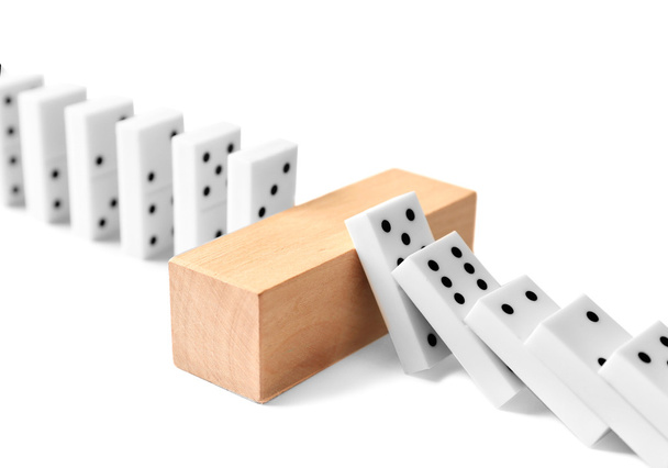 Dominoes with wooden brick - Foto, afbeelding