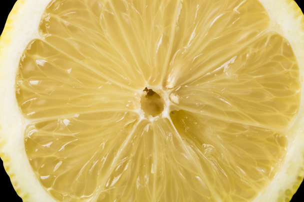 Background of ripe lemon Slice, fresh fruit texture closeup - Фото, зображення