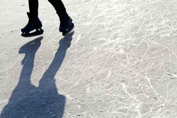 Ice Skates on the ice with shaddow - 写真・画像