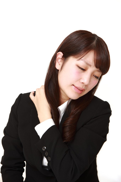 Japanese businesswoman suffers from neck ache  - Photo, Image
