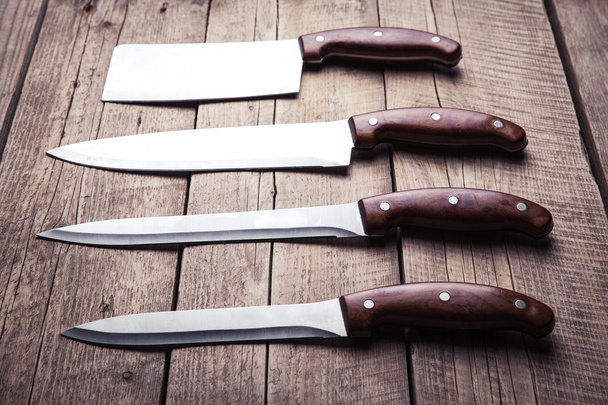 Beautiful knives with wooden handle, on an old table. Kitchen, c - Φωτογραφία, εικόνα