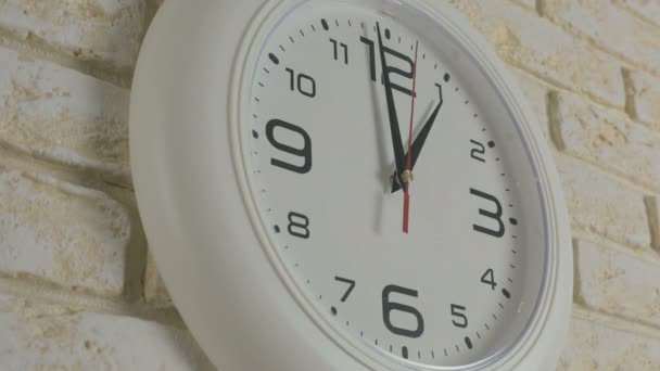 Time one hour. Timelapse. Round white clock hanging on brick wall. - Footage, Video