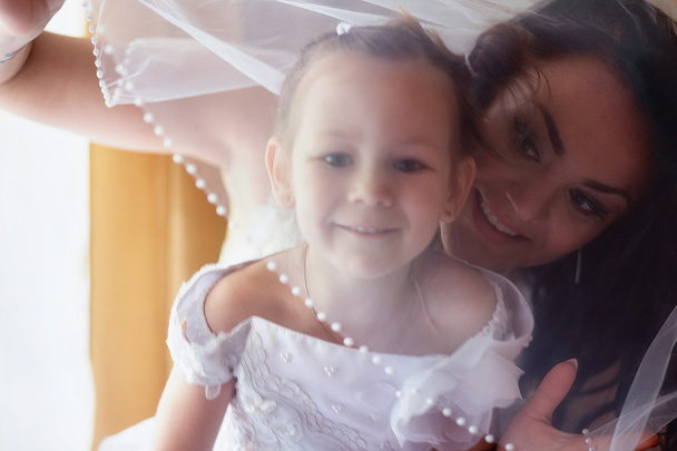 Mother and daughter in a wedding day - Photo, Image