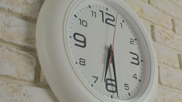 Time six hours thirty minutes. Timelapse. Round white clock hanging on brick wall. - Footage, Video