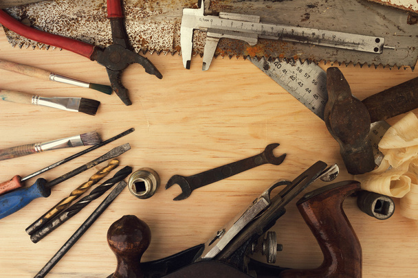 Old rusty tools on a wooden background - Fotografie, Obrázek