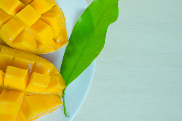 Sliced ripe yellow mango with leaf - Photo, Image