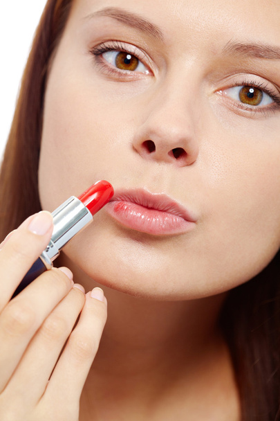 Applying lipstick - Фото, зображення