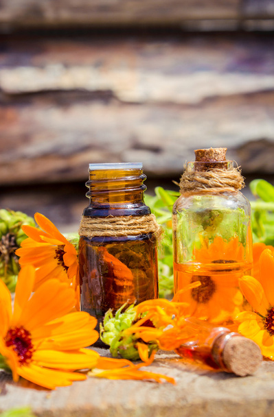 Small bottle of calendula oil (Pot marigold extract, tincture, infusion) - Photo, Image