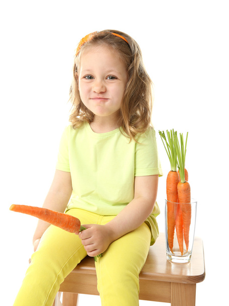 Beautiful girl with carrots, isolated on white - Fotoğraf, Görsel