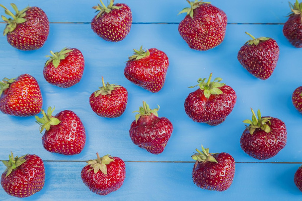 Fresh strawberries on blue background - Fotografie, Obrázek