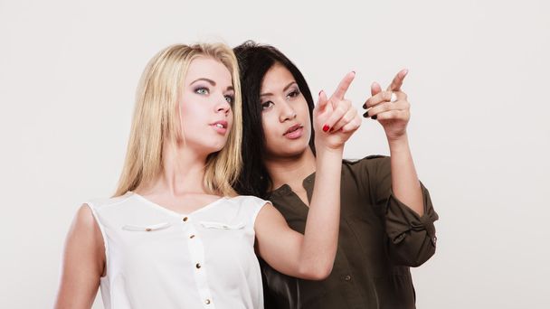 Two fashion women pointing wit finger - Fotografie, Obrázek