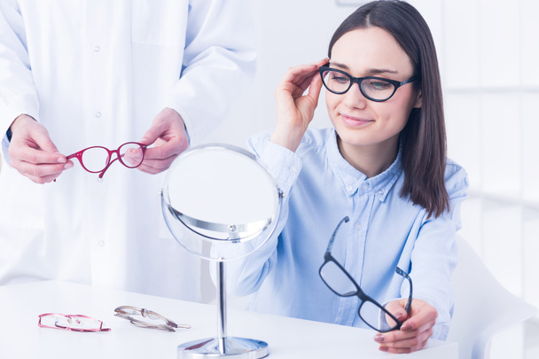 Woman with vision defect and optician's consultation - Foto, Bild