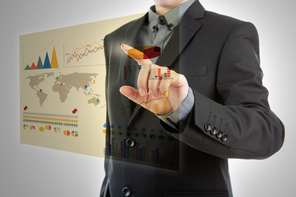 Business man pressing high tech type of modern graph on a virtua - Фото, изображение