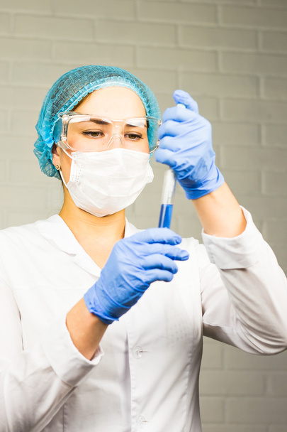 Scientist looking at test tube in the laboratory of university. - Φωτογραφία, εικόνα