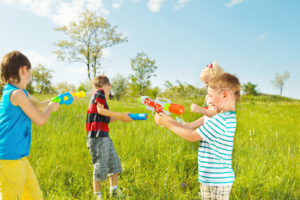 Kids group with water guns and soakers - Fotografie, Obrázek
