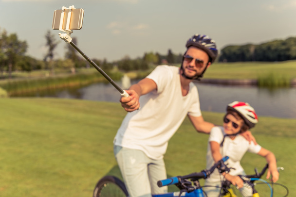Dad and son cycling - Photo, Image