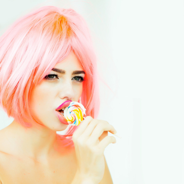 woman with orange hair lick lollipop - Φωτογραφία, εικόνα