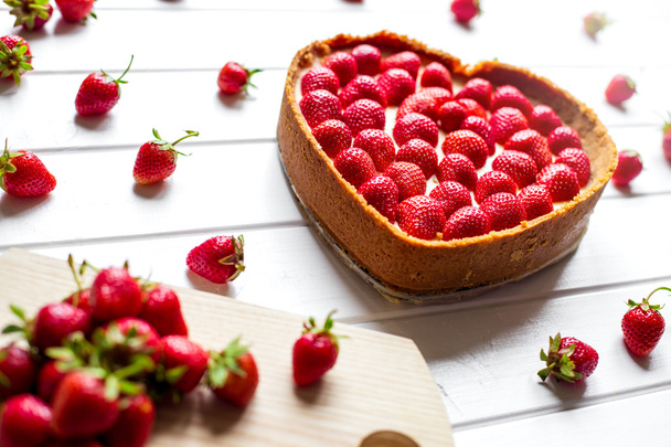 Cheese cake with fresh berries on wooden table. Selective focus - Fotó, kép