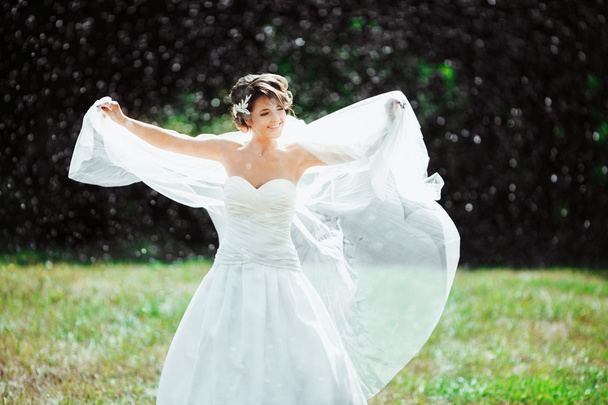 Bride standing under rain - Fotoğraf, Görsel