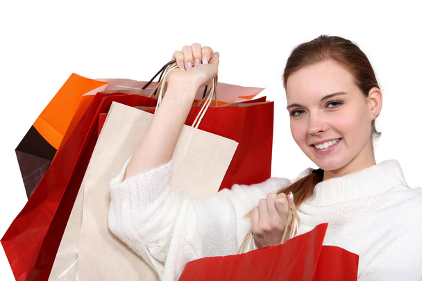 A woman with plenty of shopping bags. - Φωτογραφία, εικόνα