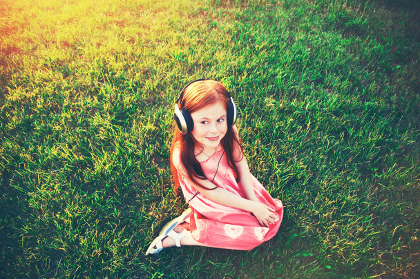 redhead girl with headphones  - Photo, image