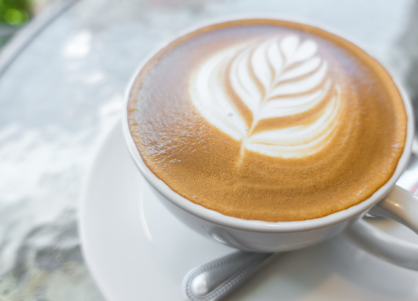 Latte Coffee art on the wooden table . - Foto, Imagem