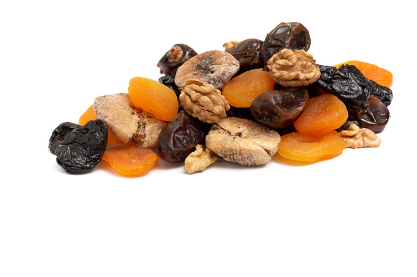 Heap of dried fruits and walnuts. - Фото, зображення