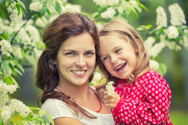 Happy mother and daughter in summer park - 写真・画像