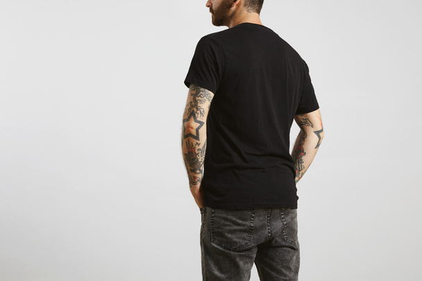 man poses backside in black blank t-shirt - Фото, зображення