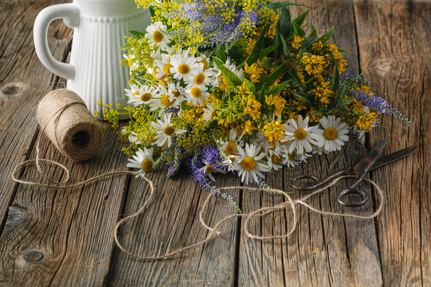 Chamomile flowers on a wooden background. Studio photograp - Photo, image