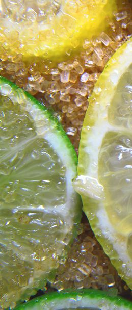 slices of limes and lemons mixed with cane sugar  - Photo, Image