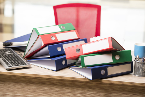 Stacks of office binders on desk - Photo, Image