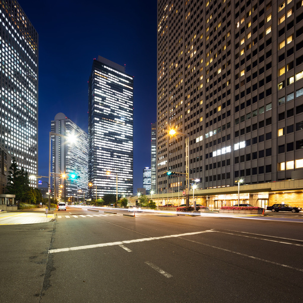 traffic on road in downtown of Tokyo at night - Photo, Image
