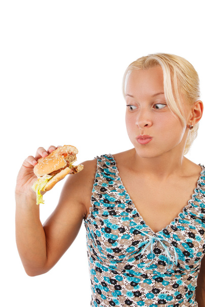Mujer rubia comiendo hamburguesa
 - Foto, imagen