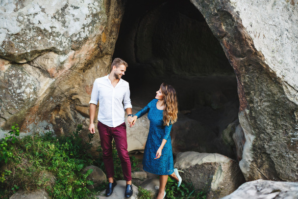 Couple near the cave - Photo, Image