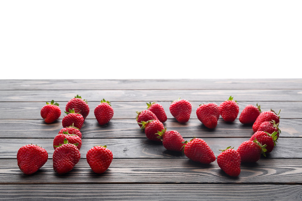 words i love you lettered with fresh organic strawberry. - Foto, Imagem
