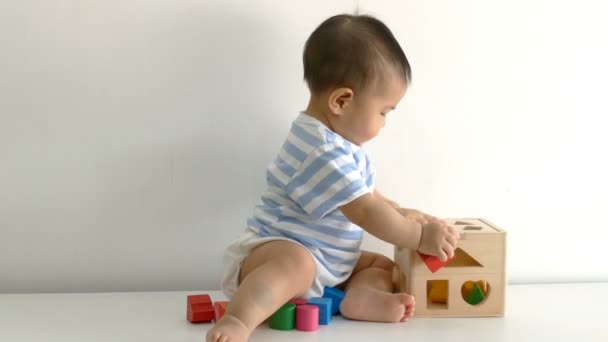 Little child playing with wood blocks  - Footage, Video