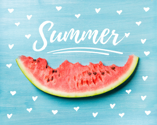 Slice of watermelon on turquoise blue background - Fotó, kép