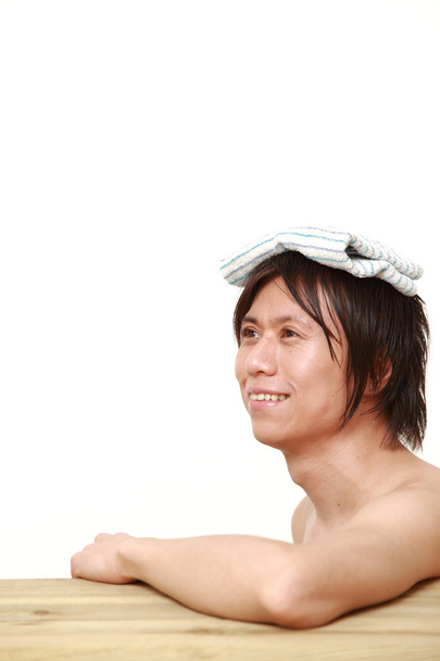 young man relaxing Japanese traditiona bath - 写真・画像