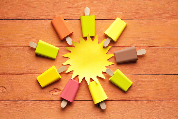 Colorful ice lollies on wooden table - Foto, Imagem
