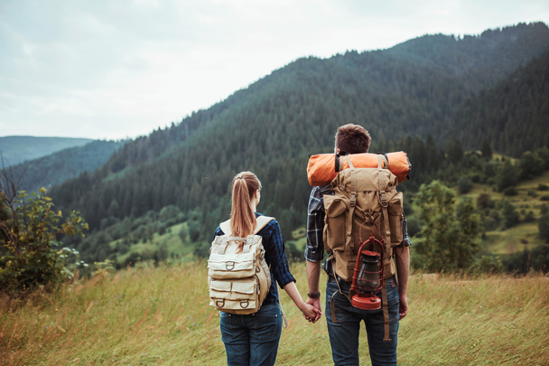 A couple hikers Hiking with backpacks - 写真・画像