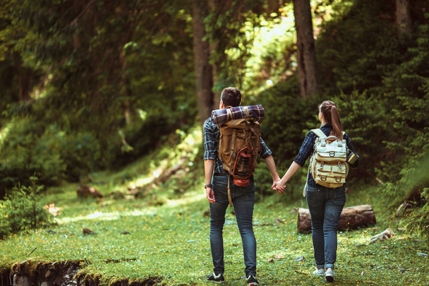 A couple hikers Hiking with backpacks - Фото, зображення