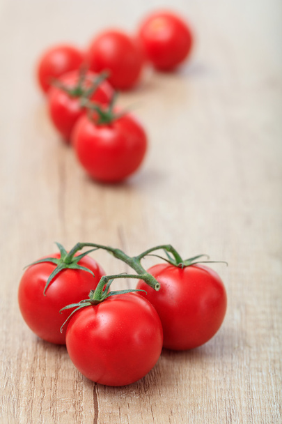 cherry tomatoes on a wooden surface - Foto, immagini