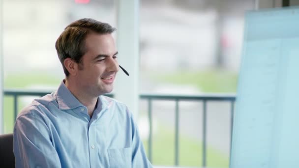 business man at office desk with headset - Felvétel, videó