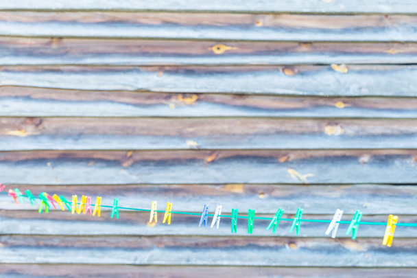 Colorful clips hanging on washing line - Photo, Image