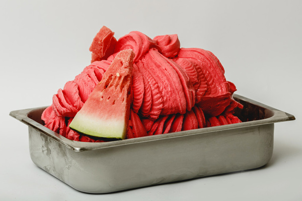 Water melon ice cream in the metal tray on white background - Φωτογραφία, εικόνα