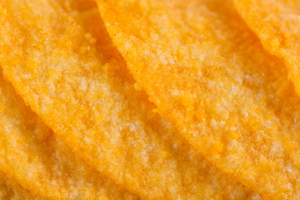 Detail of fried potato chips close up - Foto, afbeelding